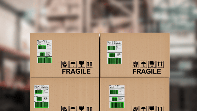 Boxes with barcode labels in a warehouse. The barcodes show green overlays as they have been scanned with the Viziotix barcode scanner SDK. Experts in barcode scanning. Viziotix barcode reader SDK. Viziotix barcode decoder SDK.