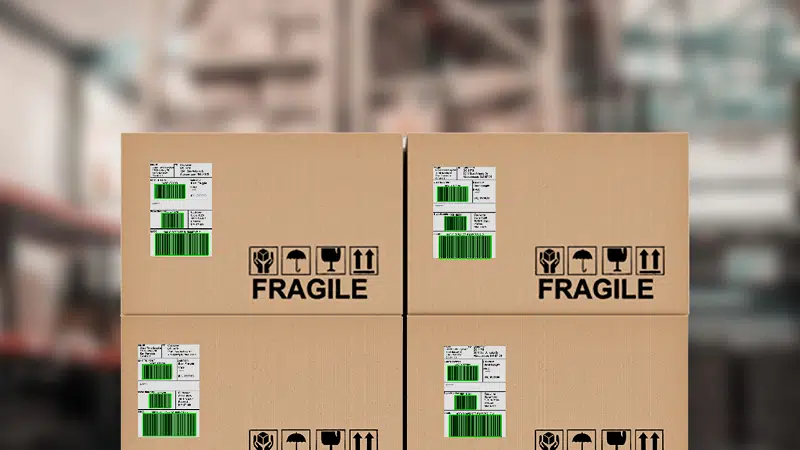 Inventory Management with Barcode Scanning. Boxes with barcode labels in a warehouse. The barcodes show green overlays as they have been scanned with the Viziotix barcode scanner SDK. Experts in barcode scanning. Viziotix barcode reader SDK. Viziotix barcode decoder SDK.