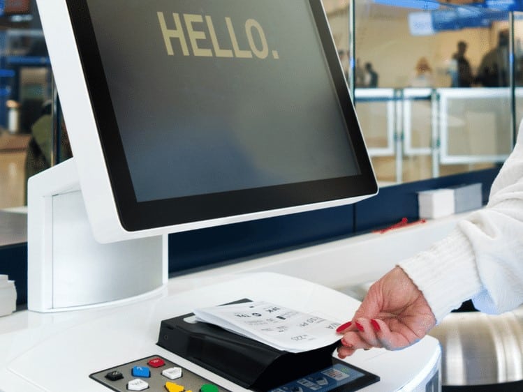 A paper airline ticket being scanned by a barcode scanner in a ticket kiosk. Viziotix barcode reader SDK. Also known as Barcode Scanner SDK or Barcode Decoder SDK.